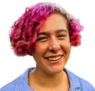 A headshot of Chiqui Diaz, a female-presenting person, who smiles at the camera.