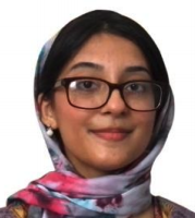 A headshot of Samia Zia, a female-presenting person, who smiles towards the camera.