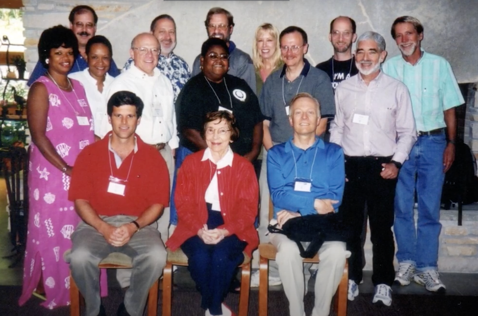 A group of 15 adults wearing nametags
